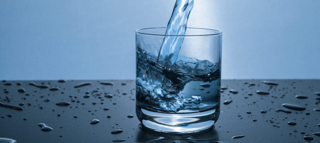 Pouring a glass of fresh water